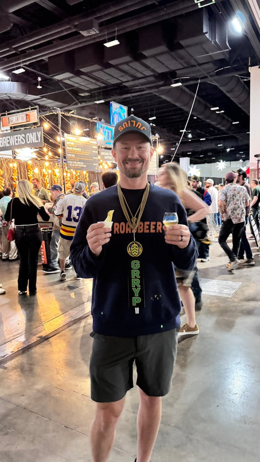 Chris at GABF with a Grryp tap handle on a lanyard