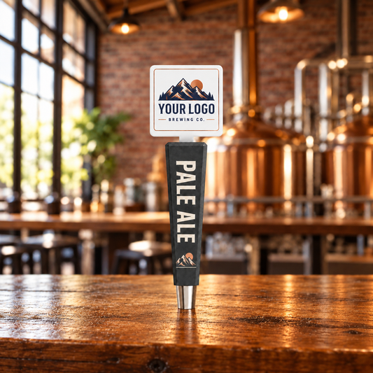 Summit charcoal tap handle with square mountain artwork topper and Pale Ale branding in a warm brewery taproom.