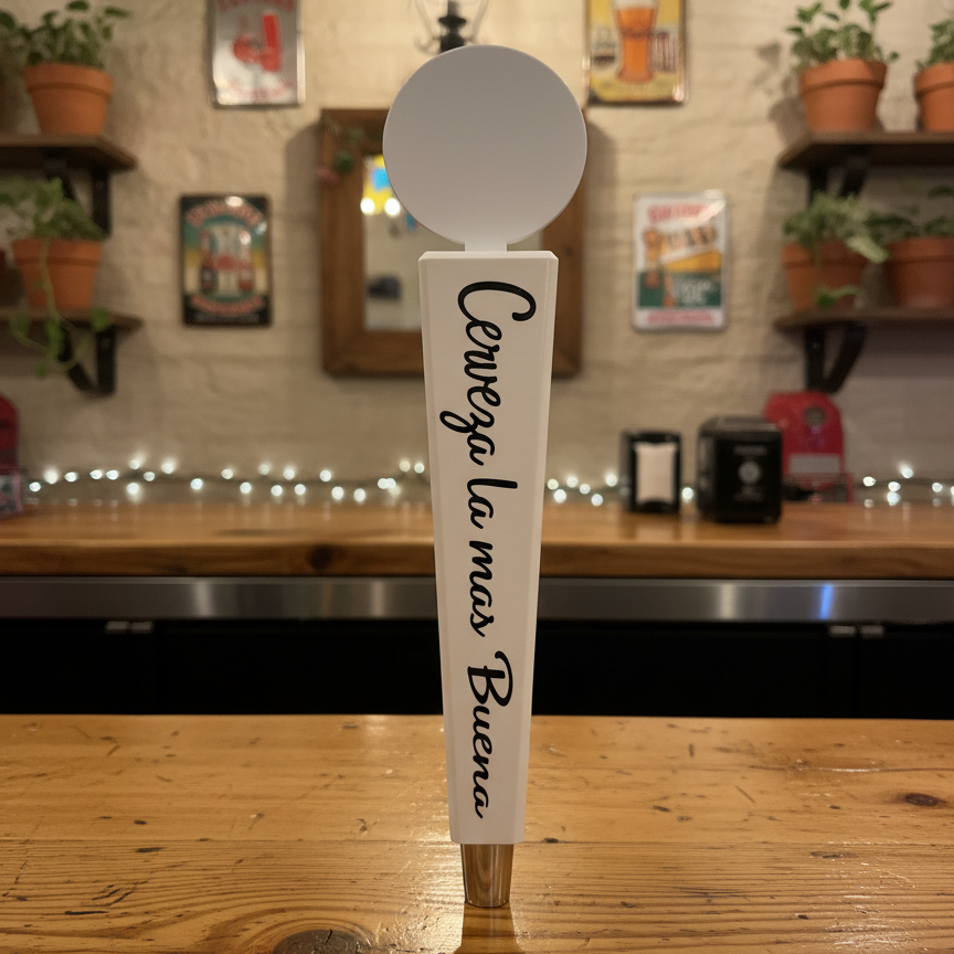 Beer tap handle with 'Cerveza La Mas Buena' text in a bar setting